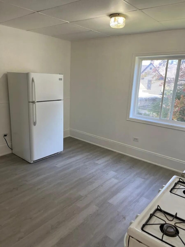 kitchen featuring white appliances, baseboards, and dark wood-style flooring