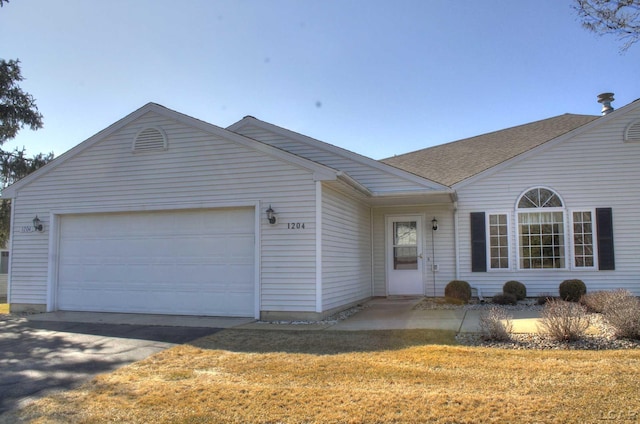 single story home with a front lawn, a shingled roof, driveway, and a garage