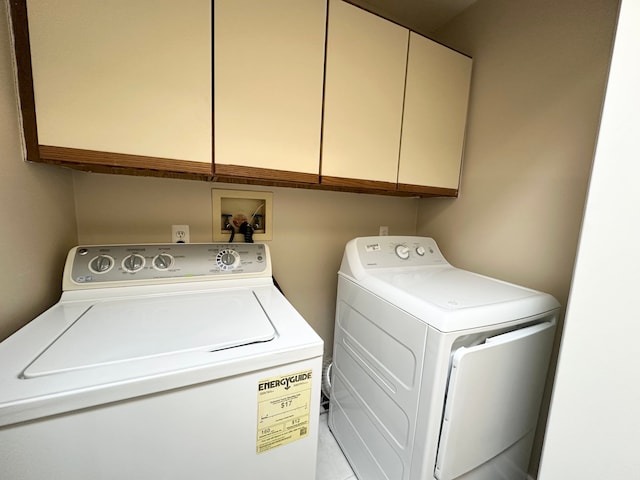 laundry area with cabinet space and washing machine and clothes dryer