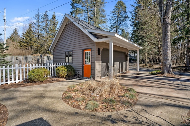 exterior space with a garage and fence