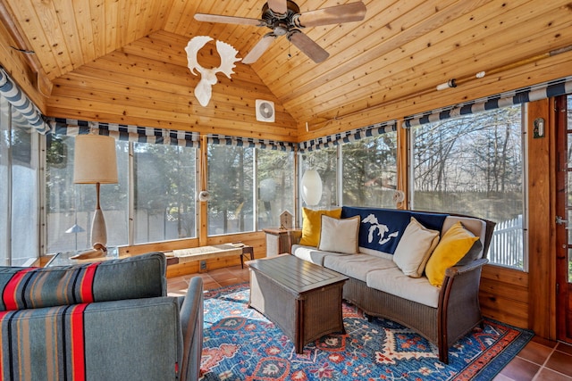 sunroom / solarium with wood ceiling, a healthy amount of sunlight, a ceiling fan, and vaulted ceiling