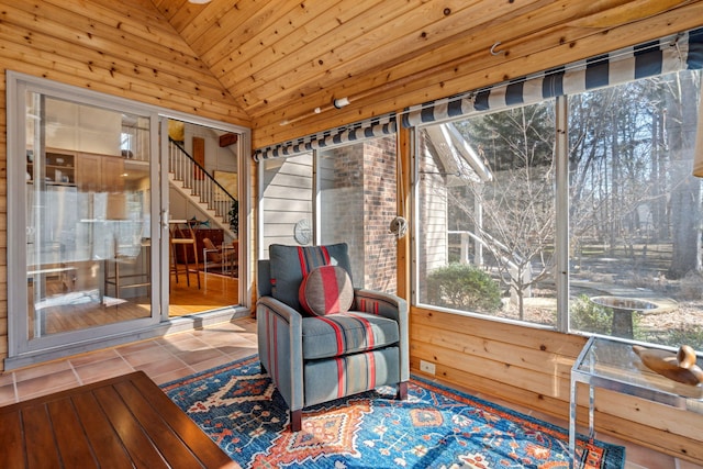 sunroom featuring wooden ceiling and lofted ceiling