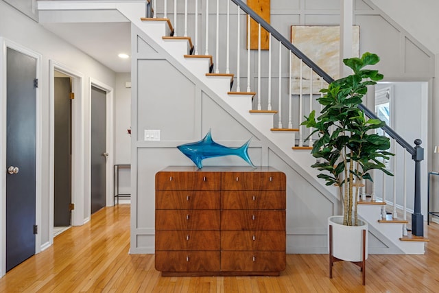 staircase with wood-type flooring