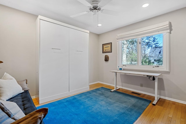 office space featuring baseboards, visible vents, light wood finished floors, recessed lighting, and ceiling fan