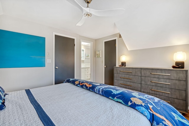 bedroom featuring lofted ceiling, ceiling fan, and ensuite bathroom