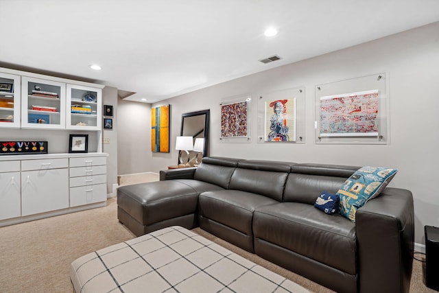 living area featuring recessed lighting, visible vents, light carpet, and baseboards