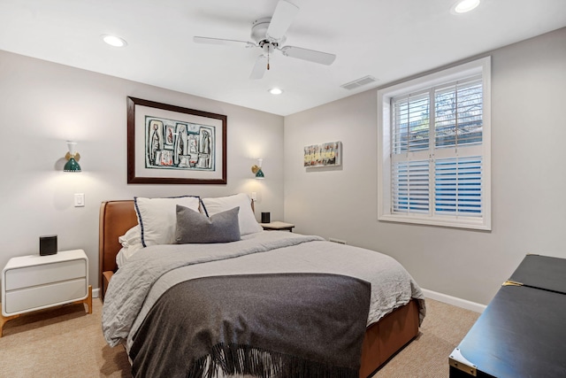 bedroom with light carpet, visible vents, recessed lighting, and baseboards