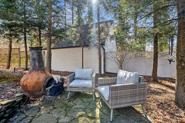 view of patio / terrace featuring fence