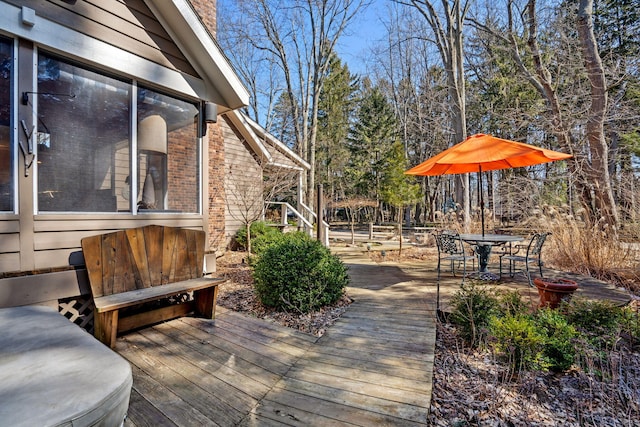 wooden deck with outdoor dining space