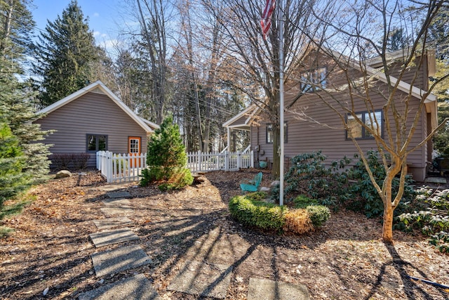 view of home's exterior with fence