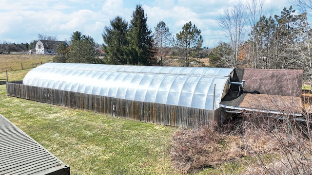 view of yard with an exterior structure and an outdoor structure