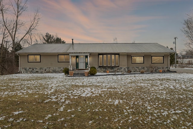 view of front of house featuring metal roof