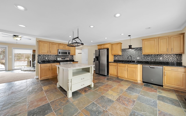 kitchen with stone tile floors, recessed lighting, a sink, appliances with stainless steel finishes, and crown molding