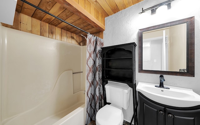 full bath featuring vanity, shower / bath combo, wood ceiling, toilet, and a textured wall