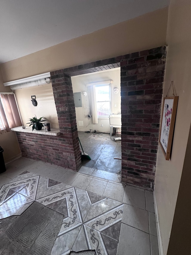 hallway with brick wall