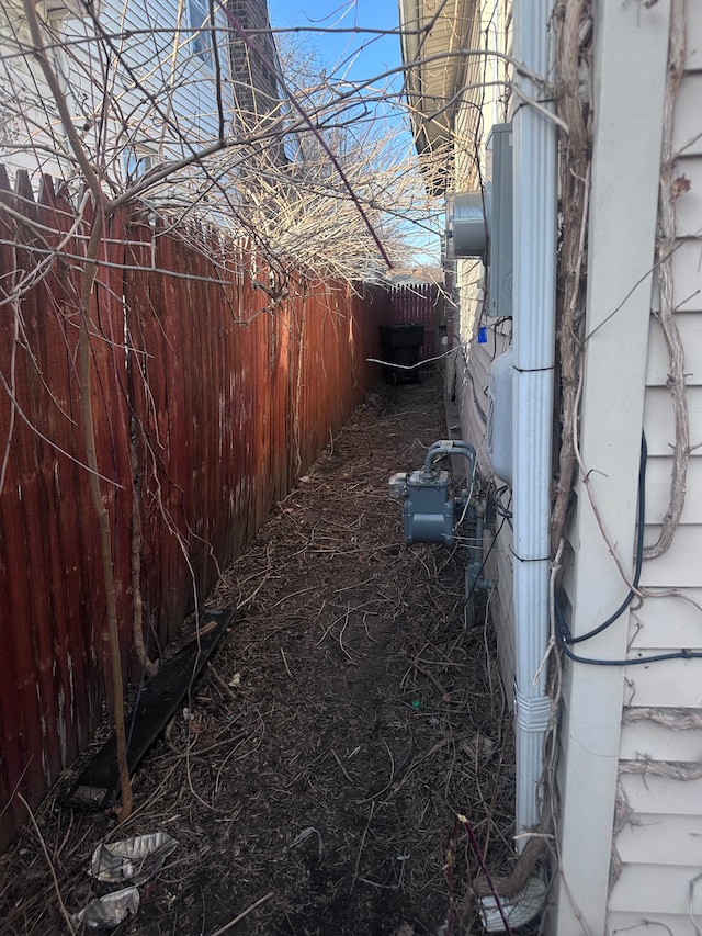 view of home's exterior with fence