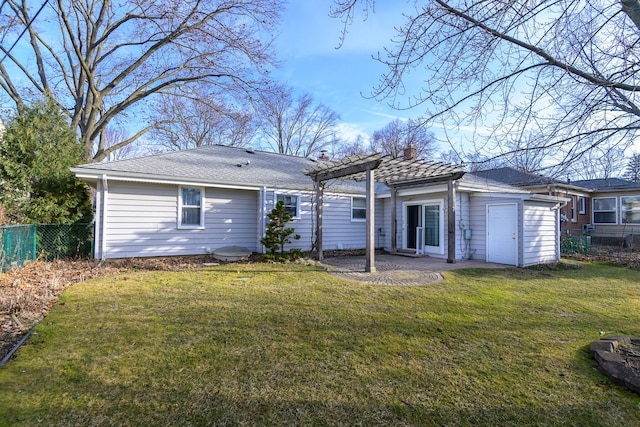 back of house featuring a yard, fence, and a pergola