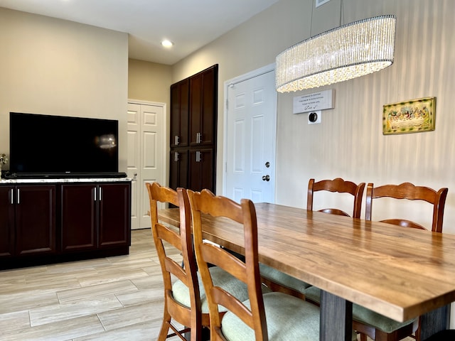 dining space featuring wood tiled floor