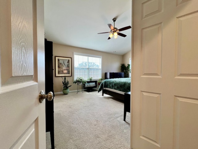 bedroom featuring carpet flooring, ceiling fan, and baseboards