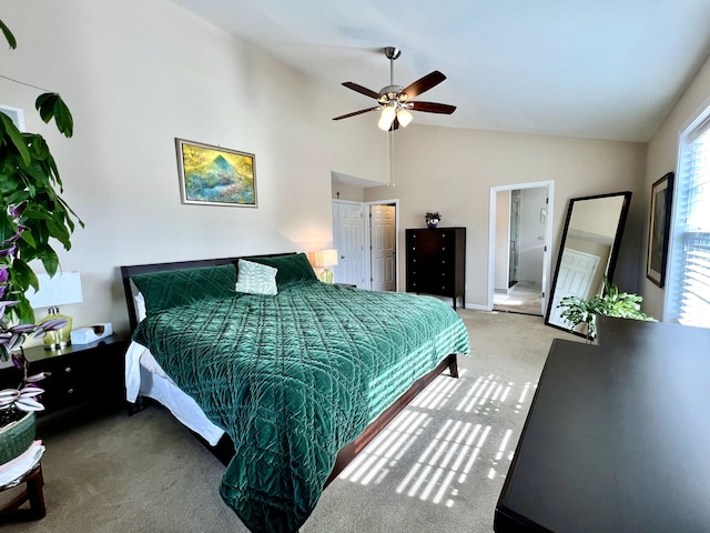 carpeted bedroom featuring high vaulted ceiling and ceiling fan