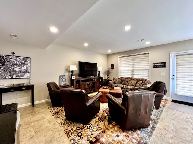 living area with recessed lighting, baseboards, visible vents, and a wealth of natural light