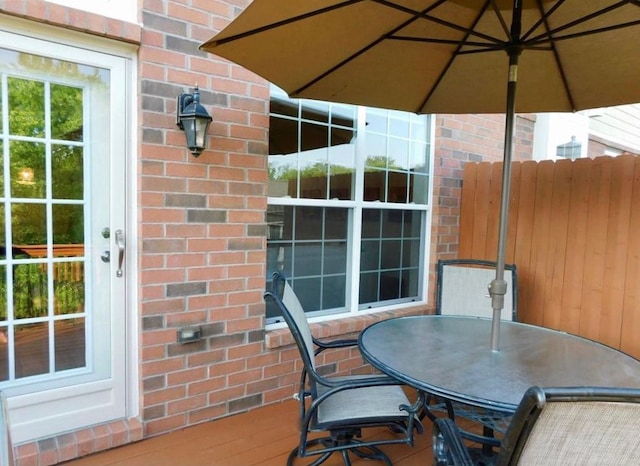 view of patio / terrace with outdoor dining area and fence