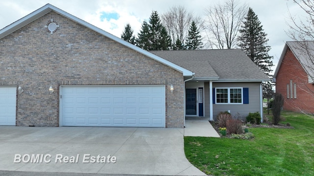 ranch-style home featuring a garage, driveway, a shingled roof, and a front lawn