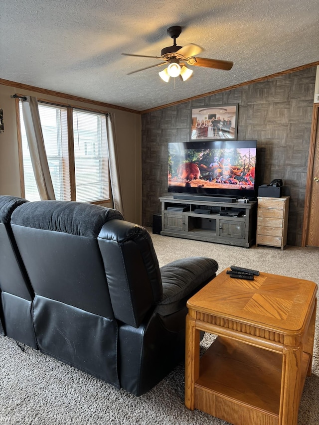 living room with ornamental molding, ceiling fan, carpet flooring, a textured ceiling, and vaulted ceiling