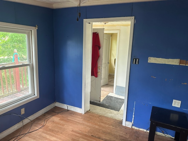 interior space with baseboards and wood finished floors