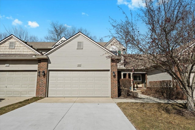 view of front of house featuring a garage, brick siding, and concrete driveway