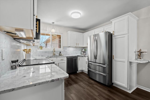 kitchen with white cabinets, dark wood-style flooring, appliances with stainless steel finishes, and a sink