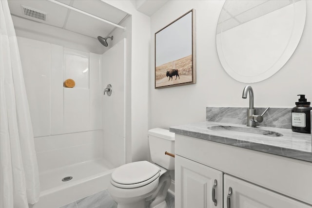 bathroom with visible vents, toilet, vanity, and a shower with curtain