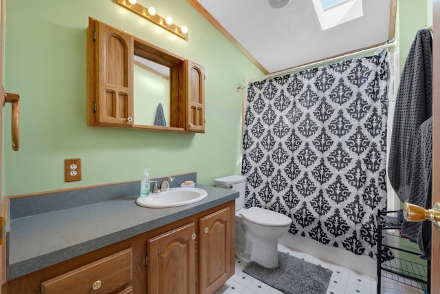 bathroom featuring vanity, a shower with curtain, vaulted ceiling with skylight, ornamental molding, and toilet