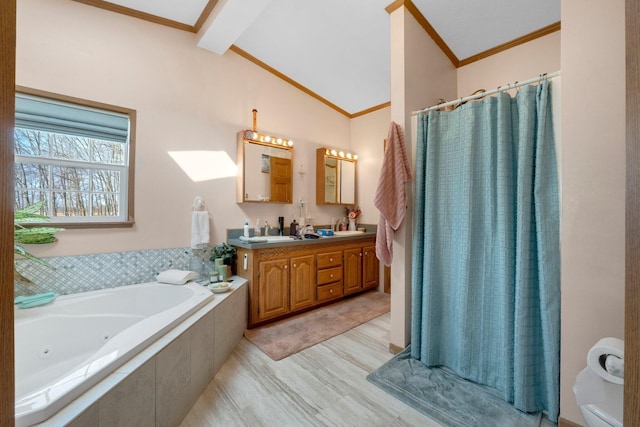 bathroom with ornamental molding, a sink, double vanity, vaulted ceiling with beams, and a whirlpool tub