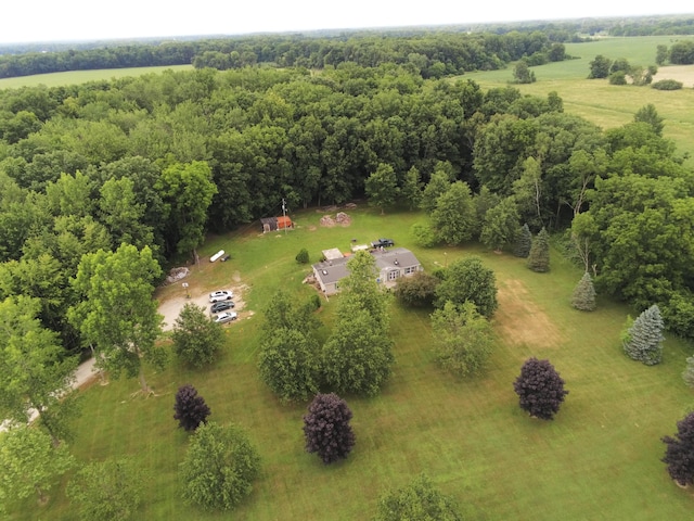 aerial view featuring a wooded view