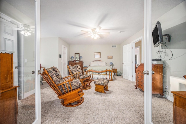 carpeted living room featuring visible vents, french doors, baseboards, and a ceiling fan