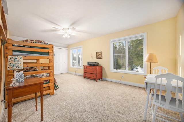 bedroom featuring multiple windows, baseboards, carpet floors, and ceiling fan