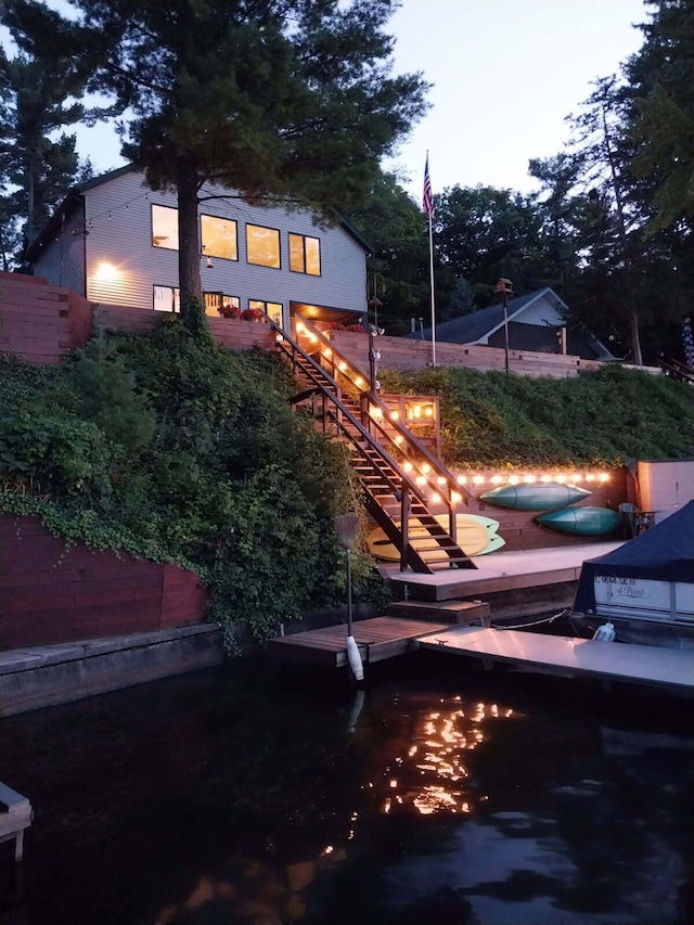 back of house with stairs