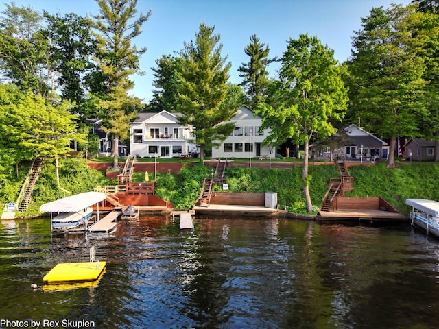 5569 Front St, Newaygo, MI 49337 - dock featuring stairs and a water view