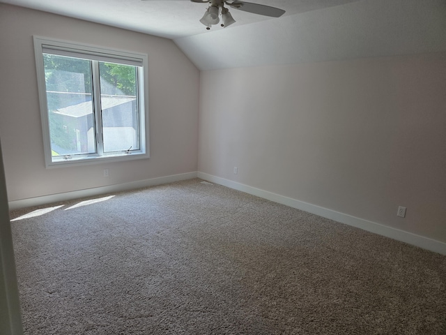 5569 Front St, Newaygo, MI 49337 - additional living space with ceiling fan, lofted ceiling, and light carpet