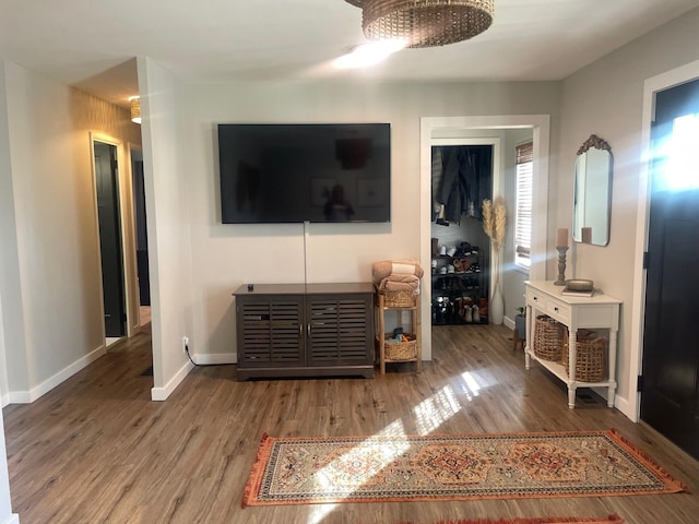 living room featuring wood finished floors and baseboards