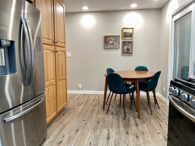 dining room featuring recessed lighting, baseboards, and light wood-style flooring