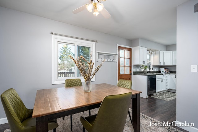 dining area featuring baseboards, a ceiling fan, and dark wood-style flooring