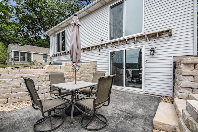 view of patio featuring outdoor dining space