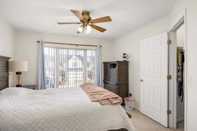 bedroom with light carpet and ceiling fan