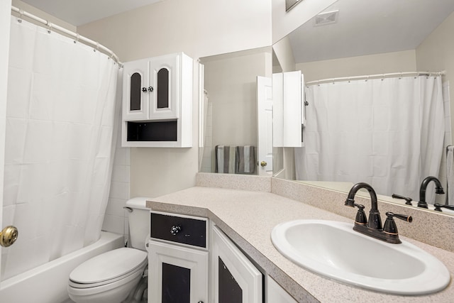 full bath with visible vents, toilet, vanity, and shower / bath combo