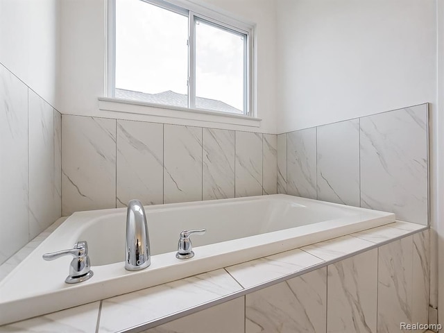 bathroom featuring a garden tub