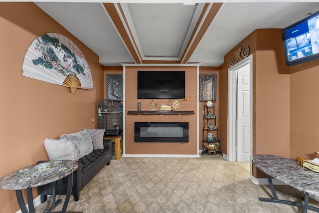 living area with a fireplace and baseboards