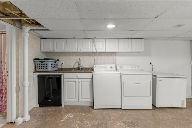 clothes washing area with laundry area, independent washer and dryer, and a sink