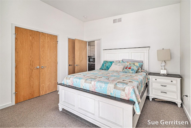 bedroom with visible vents, baseboards, and carpet